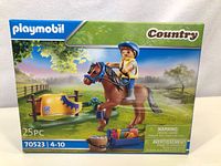 Front of Playmobil Country Horse Set box showing sealed package, horse with rider and accessories on box art.