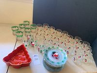 Photo of all glassware, plates stacked, and Christmas tree cake mold showing the full lot contents