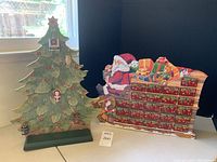 Overview of porcelain Christmas tree advent calendar on left and Santa’s sleigh advent calendar on right