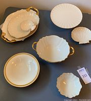 Seven piece Lenox shell motif china set arranged on table