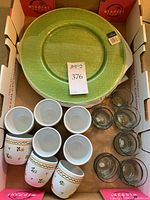 Four green Villeroy & Boch Verona glass chargers, six hand-painted Varoslodi Majolica egg cups, eleven clear glass Mexican tealight holders arranged in box