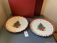 Two matching Villeroy & Boch serving platters with Christmas tree and presents design.