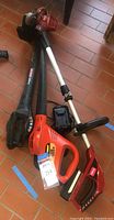 All three yard tools: Craftsman blower without battery, Black & Decker blower with battery, Toro weed whip/edger with charger.
