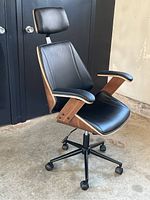 Front view showing seat, backrest, headrest, armrests and base