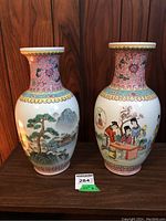 Pair of Asian porcelain vases side by side showing overall shape and design.
