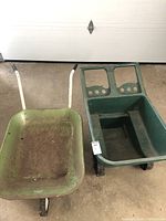 Both wheelbarrows side by side on garage floor, showing size and condition differences