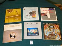 Photo of 6 vinyl records including jazz composers workshop, Vaughan Davis Jazz album, Cat Stevens albums and The King's Singers.