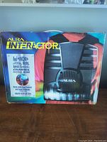 Front of the Aura Interactor box showing the product and promotional text on the packaging.