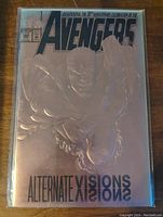 Front cover of The Avengers comic, featuring embossed characters and metallic silver finish with "Alternate Visions" text.