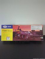 Front view of the unopened Testors Hawk North American P-51D Mustang model kit box displaying painted airplane artwork and branding.