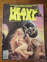 Full front cover of Heavy Metal magazine July 1989 showing fantasy artwork of a nude woman and fantastical horned creature with title and issue date.