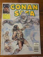 Front cover of the comic magazine showing Conan confronting a bear-like creature, title and issue number visible.