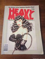 Front cover of the July 1991 Heavy Metal Illustrated Fantasy Magazine showing fantasy art of a woman holding a whip, with the title in bold red letters.