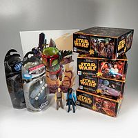 Full lot including two sealed die cast vehicles, two loose 1980 action figures Lando Calrissian and Lobot, four 100-piece Star Wars puzzles stacked, and signed Chibi Boba Fett art print.