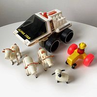 Alpha Star space vehicle with black wheels and white body, visible wear and scuffs