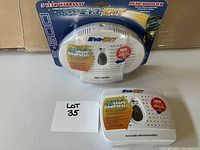 Two Eva-Dry EV-500 renewable mini-dehumidifiers, one in packaging, one out, shown with lot identifier.