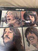 Album cover featuring close-up photos of The Beatles members John Lennon, Paul McCartney, Ringo Starr, and George Harrison in a 2x2 grid layout.