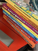 Photo of spines and covers of six children's books featuring Captain Underpants series and The Adventures of Super Diaper Baby.