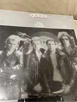 Front cover of Queen 'The Game' vinyl record album showing the band members and title text