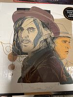 Close-up of front album cover showing illustrated portraits and sticker indicating Ron Hynes tribute and Canadian artist.