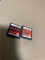 Photo of two Nintendo DS game cartridges: Ultimate Spider-Man and Monkey Ball DS.