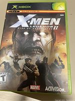 Front cover of Xbox game case for X-Men Legends II: Rise of Apocalypse showing characters and publisher logos.
