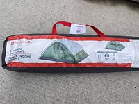 Carrying bag with brand Outdoors and image of dome tent printed on bag