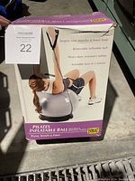 Boxed Everlast Pilates Inflatable Ball with resistance bands showing usage instructions and condition.