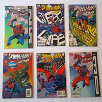 Seven Spider-Man 2099 comic books issues #22-#30 with comic art covers showing different Spider-Man action poses.