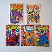 Five X-Men comic books laid out in one photo showing front covers.