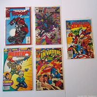 Lot of five comic books in protective sleeves showing front covers. Titles include Night Thrasher, Ninjak, Secret Wars, WildStorm and The Invaders.