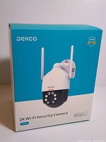 Image of the retail box showing the DEKCO 2K Wi-Fi Security Camera DC5L with branding and product image.