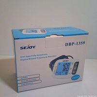 Front view of product box showing brand, model DBP-1359, and key features including large LCD and 2x60 memory.