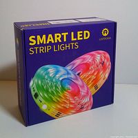 Front of box showing colorful image of two rolls of LED strip lights labeled as 'Smart LED Strip Lights' by Listocasa.