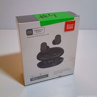 Front view of the TN33 earbuds sealed box showing earbuds and charging case with LED battery display.