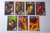 Front view of all 7 Ultimate Spider-Man comic books, arranged in two rows. Issues 63 to 69 visible with distinct cover art featuring Spider-Man in various poses.