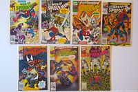 Eight Web of Spider-Man comics arranged in two rows showing cover art including Spider-Man and villains.