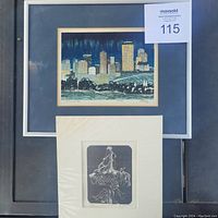 Framed cityscape artwork by George Weber alongside an unframed smaller black and white print.