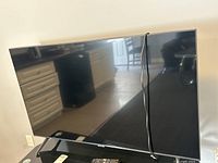 Front view of Samsung 50" TV on stand