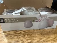 Three new vases in original box, sealed, with visible bubble wrap packing.