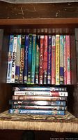 Two photos of assorted DVDs in a shelf including Disney animated titles, comedy, and drama movies with colorful DVD spines