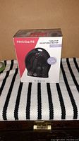 Front view of the boxed Frigidaire tabletop adjustable heater showing brand, model type and heat output.