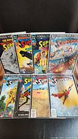Full set of eight Superman comics from the Funeral For A Friend story arc laid out, showing their front covers.