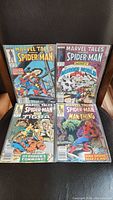 Four vintage Marvel Tales Spider-Man comics displayed showing cover art and issue numbers 201-204.