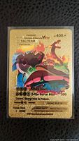 Front of the card showing Venusaur, Charizard and Blastoise artwork and card details
