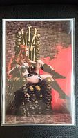 Photo of the Red Sonja 1:10 Ratio Variant Comic Book showing cover art of Red Sonja sitting on skull throne.