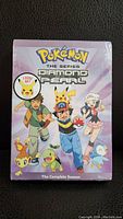 Front photo showing the sealed Pokemon Diamond & Pearl complete season DVD set packaging with illustrated main characters and Pokemon.