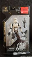 Front view of the sealed Star Wars Imperial Hovertank Driver figure in blister pack showing figure and accessory with 50th Lucasfilm anniversary logo.