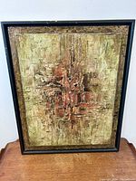 Frontal photo of the abstract brutalist oil painting on wood panel in a black frame on wooden surface, showing overall condition and details of the artwork.