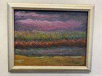 Framed abstract landscape painting showing purple horizon and textured layers of color